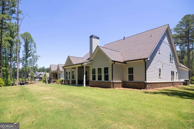 back of house with a lawn and cooling unit