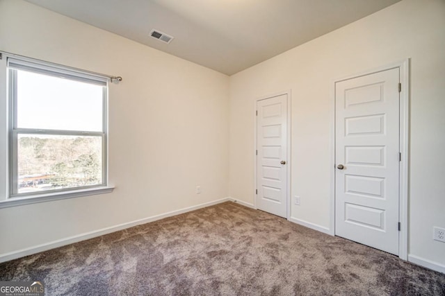 unfurnished bedroom featuring carpet flooring