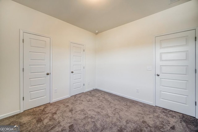 spare room featuring carpet flooring