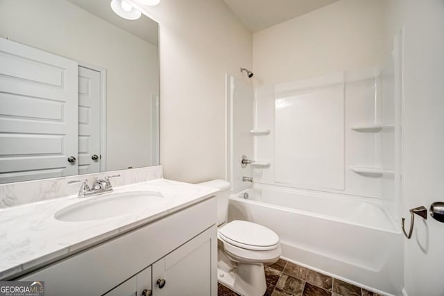 full bathroom featuring toilet, vanity, and tub / shower combination