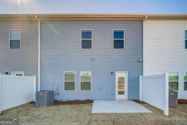 back of house featuring cooling unit and a patio