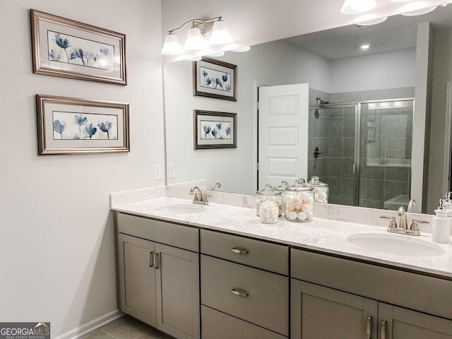 bathroom featuring vanity, tile patterned floors, and an enclosed shower