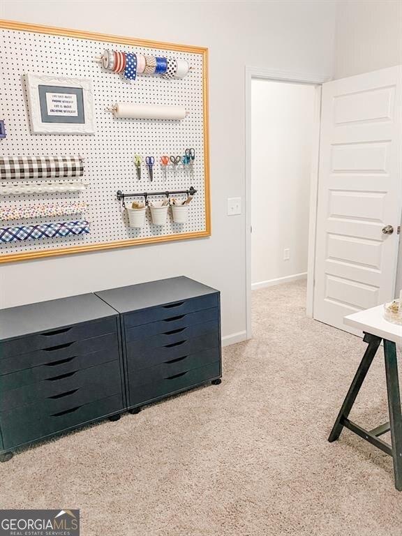 hallway with light colored carpet