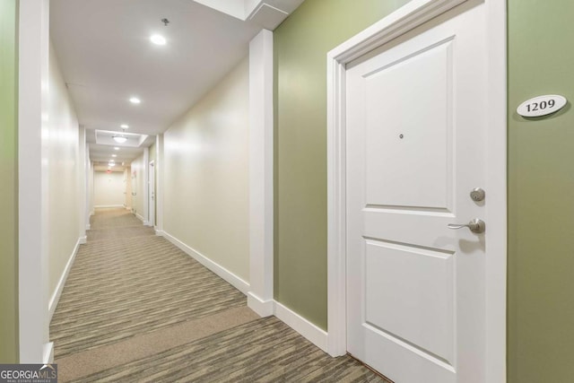 corridor featuring carpet floors