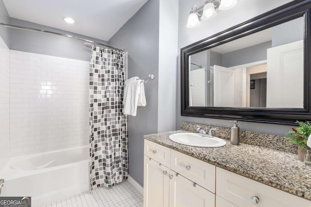 bathroom with tile patterned flooring, vanity, and shower / bath combo with shower curtain