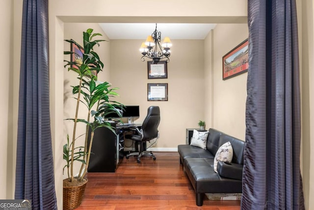 office with a chandelier and dark hardwood / wood-style floors