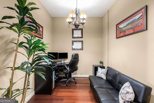 office space with dark wood-type flooring and a chandelier