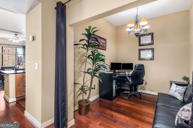 office featuring ceiling fan with notable chandelier and dark hardwood / wood-style floors