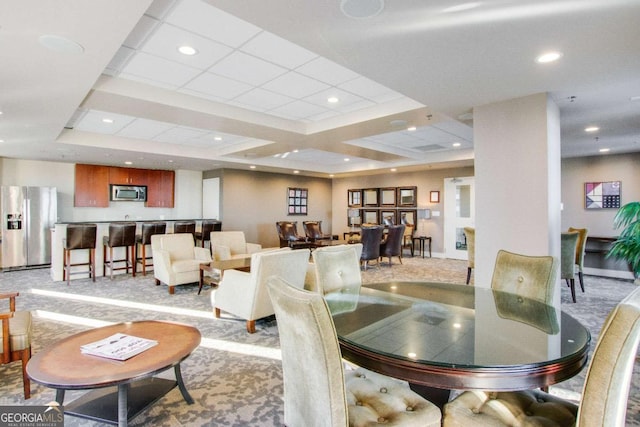 dining room with light colored carpet