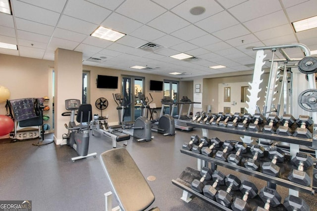 gym featuring a drop ceiling