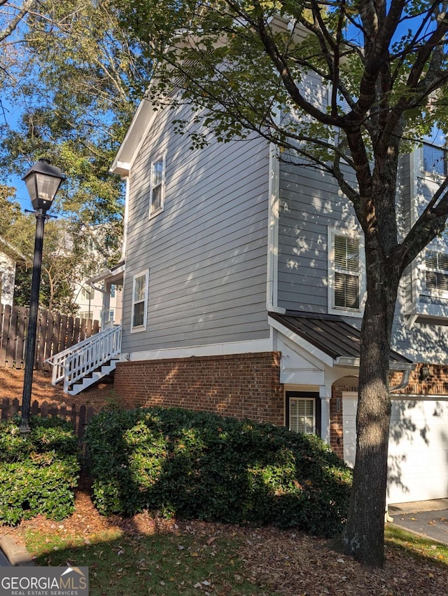 view of property exterior featuring a garage