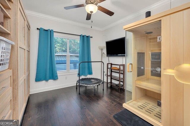 sitting room featuring dark hardwood / wood-style floors, ceiling fan, and crown molding