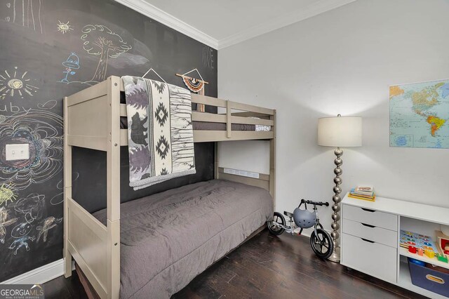 bedroom with dark wood-type flooring and ornamental molding