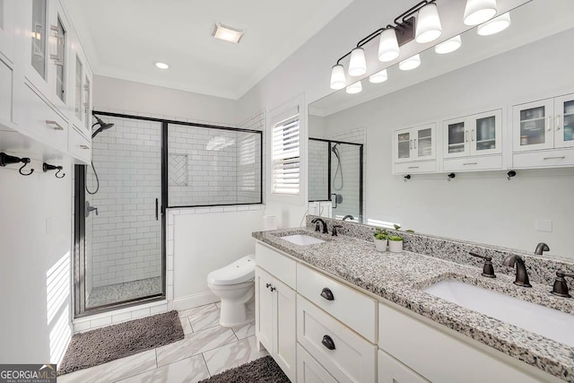 bathroom featuring vanity, toilet, and walk in shower