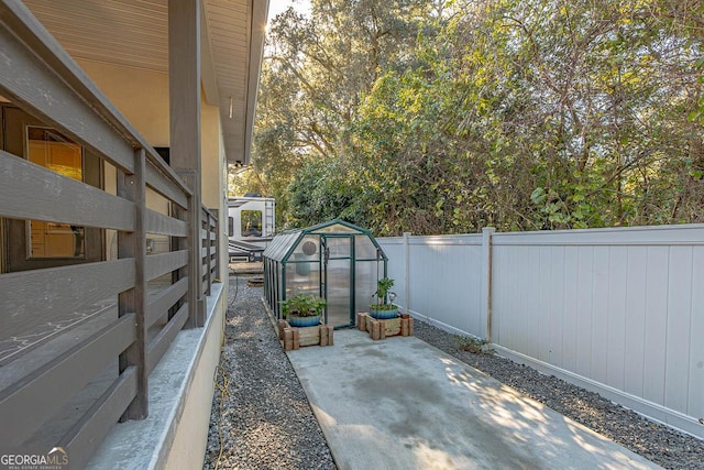 view of patio featuring an outdoor structure