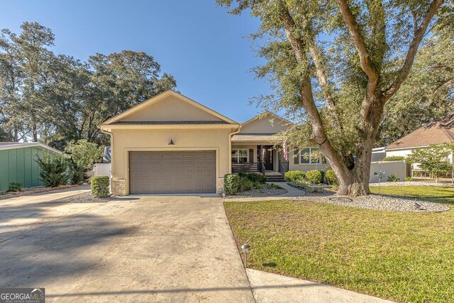 ranch-style home with a front lawn and a garage