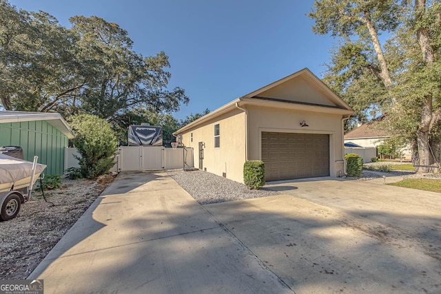 view of property exterior featuring a garage