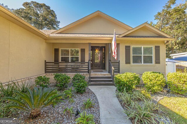 entrance to property with a porch