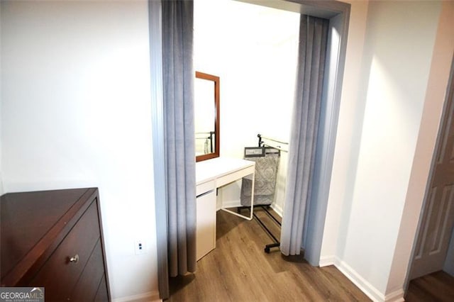 hallway featuring light hardwood / wood-style flooring