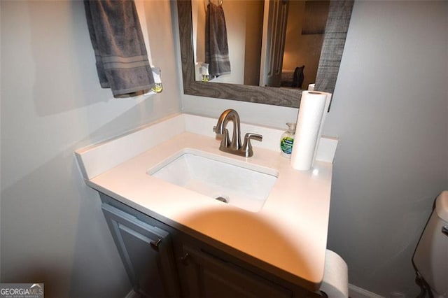 bathroom with vanity and toilet