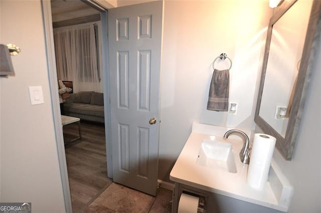 bathroom with vanity and wood-type flooring