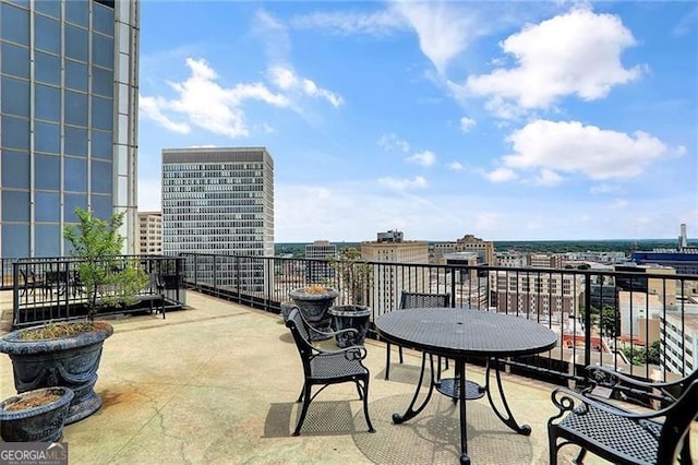 view of patio featuring a balcony