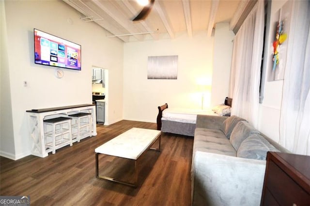 living room with ceiling fan, beam ceiling, and dark wood-type flooring