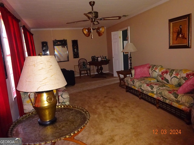 living room with carpet, ceiling fan, and ornamental molding