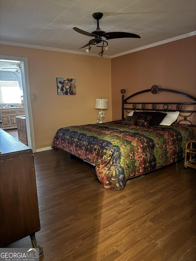 bedroom with hardwood / wood-style flooring, ceiling fan, and crown molding