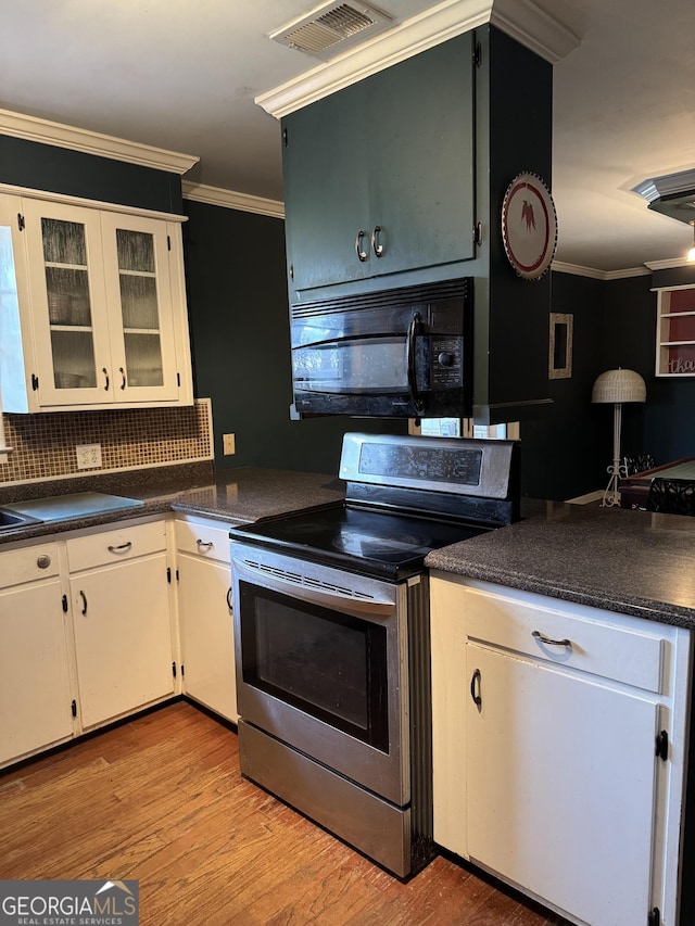 kitchen with stainless steel range with electric stovetop, decorative backsplash, ornamental molding, light hardwood / wood-style floors, and white cabinetry