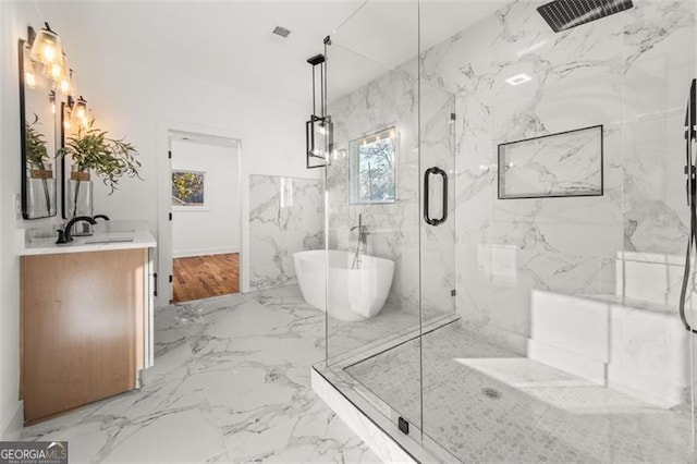 bathroom featuring vanity and plus walk in shower