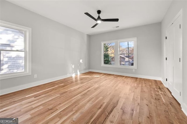 unfurnished bedroom featuring ceiling fan and light wood-type flooring