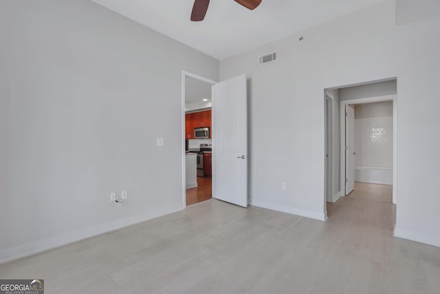 interior space with ceiling fan and light wood-type flooring