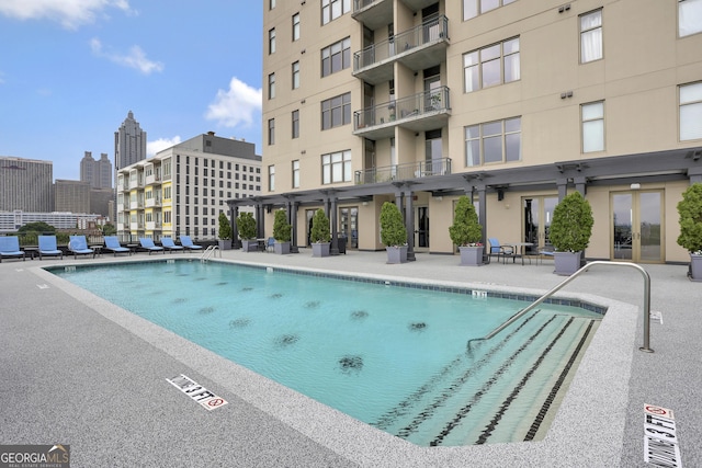 view of pool featuring a pergola and a patio area