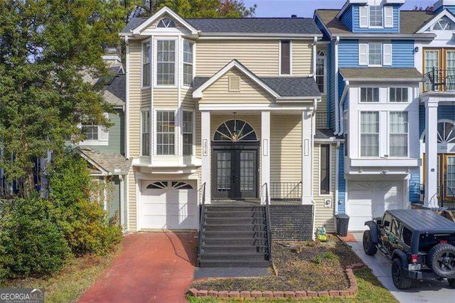 townhome / multi-family property featuring a garage