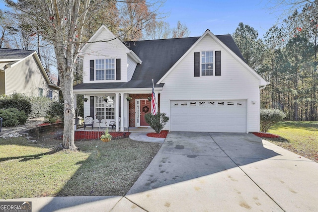 view of front of house featuring a front yard, a garage, and covered porch