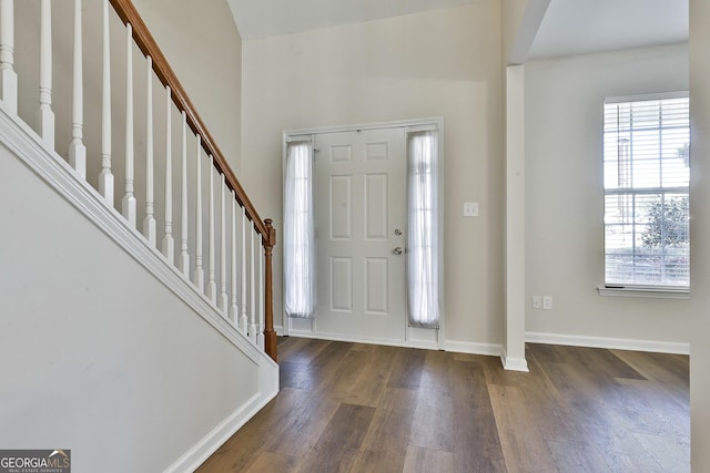 foyer entrance featuring dark hardwood / wood-style floors