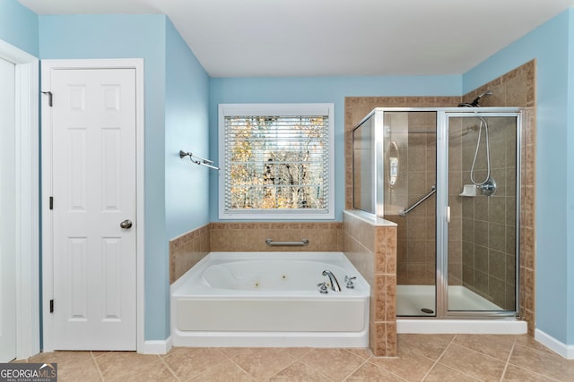 bathroom with tile patterned flooring and separate shower and tub