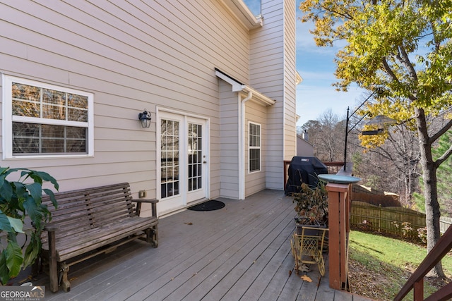 wooden terrace featuring area for grilling