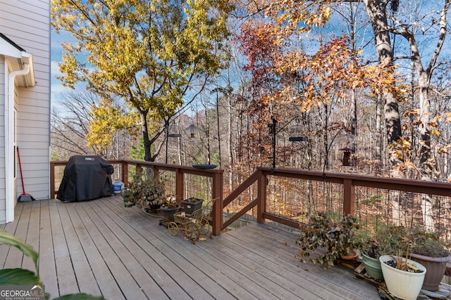 wooden terrace with area for grilling