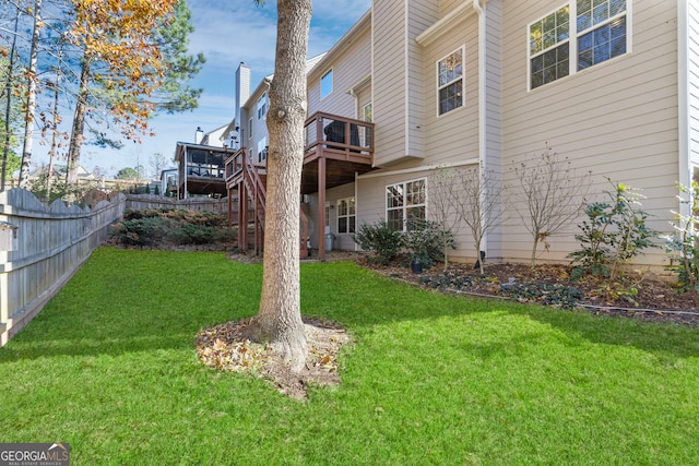 view of yard featuring a wooden deck