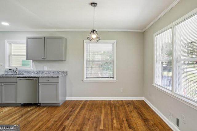 kitchen with dishwasher, dark wood-type flooring, and a healthy amount of sunlight