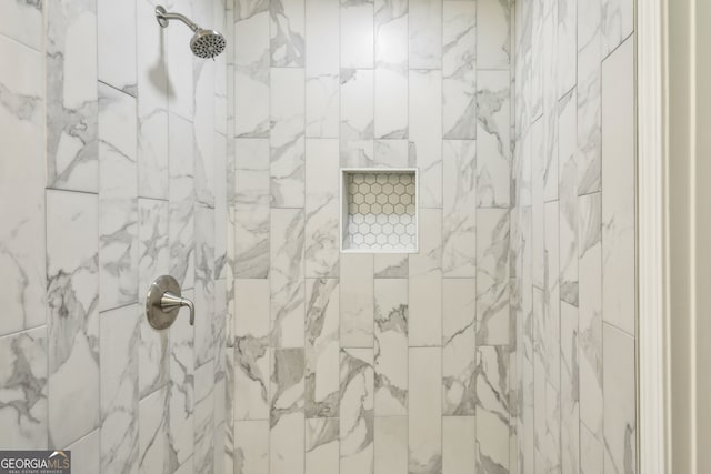 bathroom featuring tiled shower