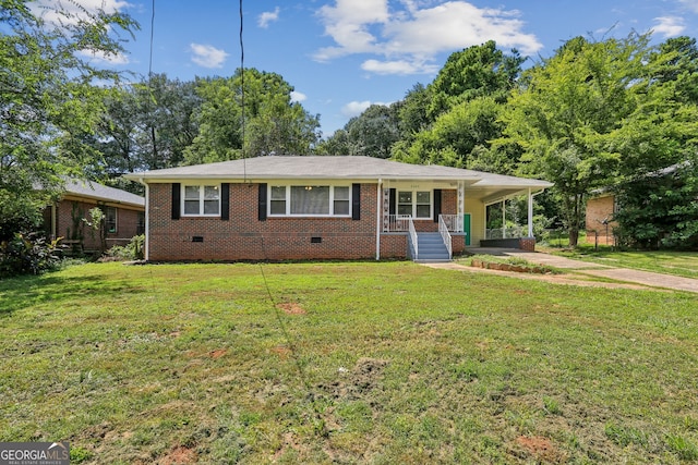 ranch-style house with a porch, a front yard, and a carport