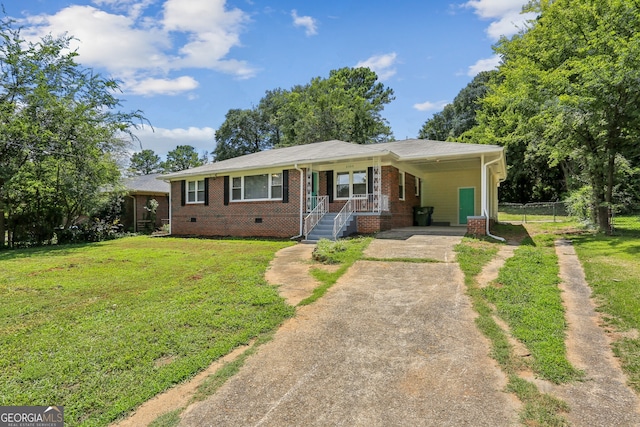 view of front facade featuring a front lawn and a carport