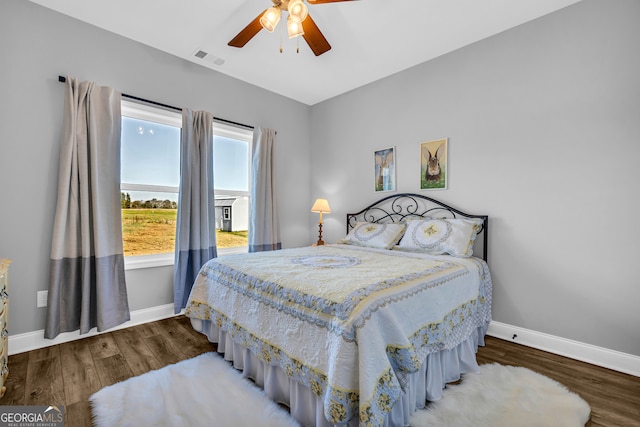 bedroom featuring hardwood / wood-style flooring and ceiling fan