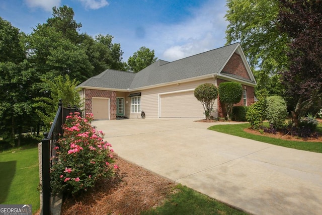 view of front of property with a front yard and a garage