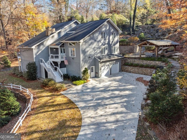 view of side of home featuring a garage