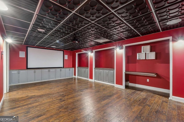 home theater room featuring dark hardwood / wood-style floors