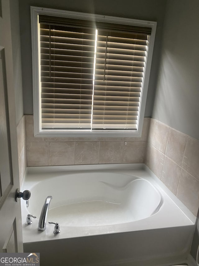 bathroom featuring a tub to relax in